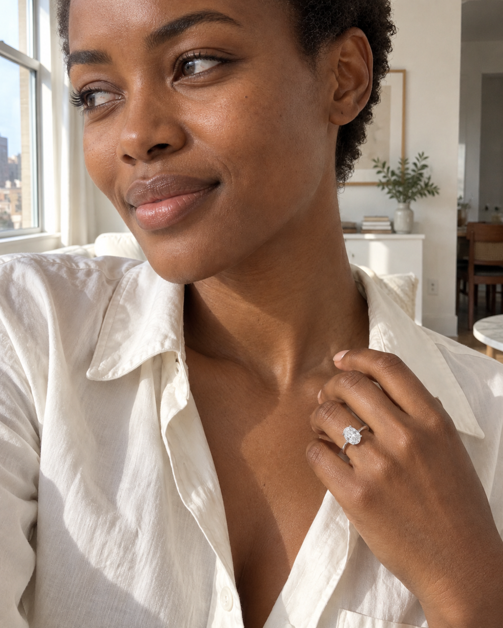 Éclat oval ring styled with an ivory shirt
