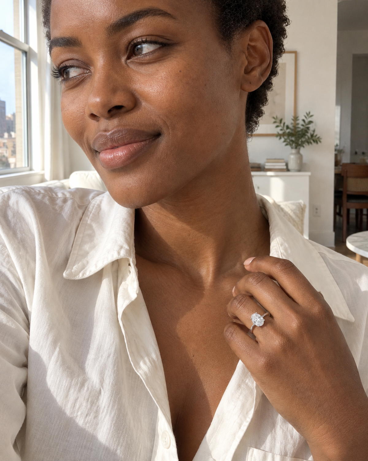 Éclat oval ring styled with an ivory shirt