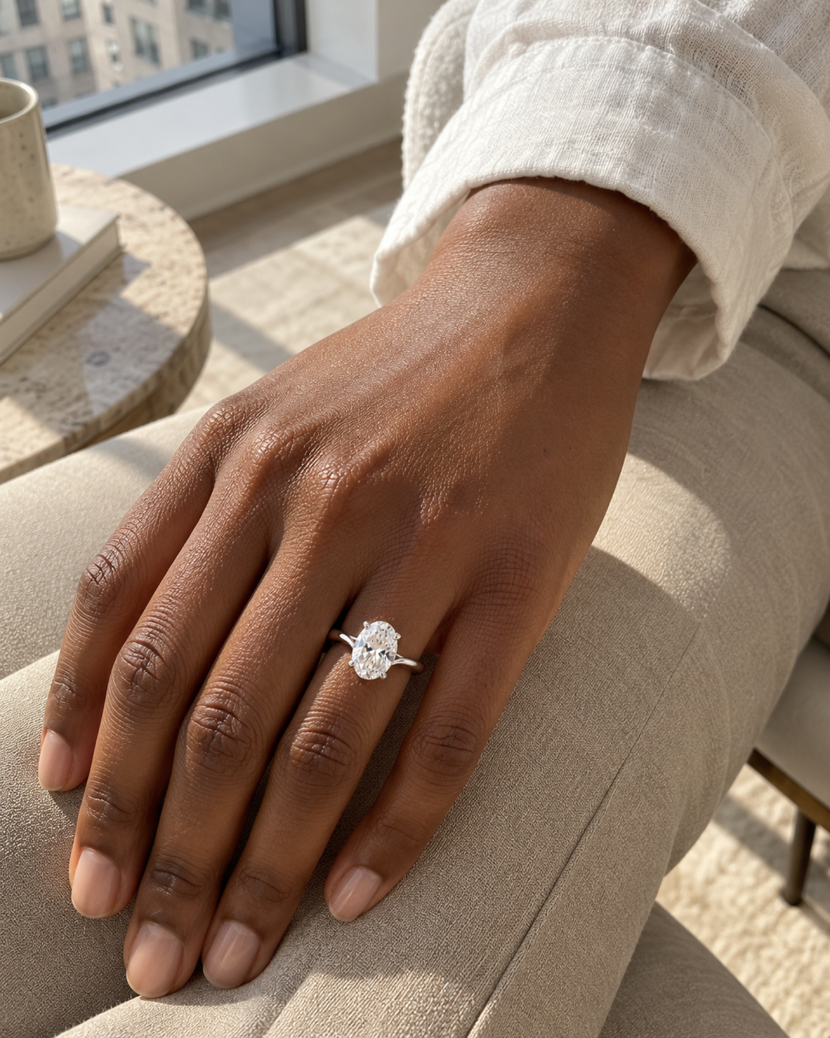 Éclat oval ring worn with neutral linen